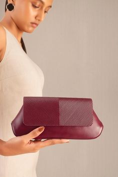 Wine clutch in faux leather base with corded flap.
Composition: 100% PU/Faux Leather
Color: Wine
Other Details: 
Dimensions (in inches): L x W x D: 10 x 1.8 x 4.5
 - Aza Fashions Leather Envelope Bag With Detachable Strap, Elegant Faux Leather Travel Clutch, Chic Burgundy Bag With Leather Lining, Textured Leather Pouch Clutch, Formal Textured Faux Leather Bag, Faux Leather Clutch For Travel, Faux Leather Travel Clutch, Work Clutch With Detachable Strap, Business Leather Clutch