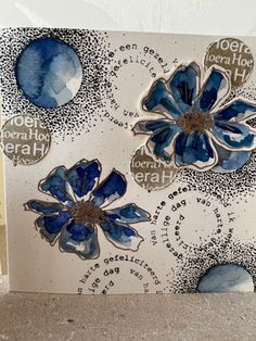 a card with blue flowers and words on it