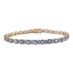 This is part of Chairish’s Fine Jewelry assortment.  Blue Sapphire and Diamond Tennis Bracelet in 14K Gold showcases 31 endlessly sparkling natural  sapphires weighing 10.39 carats and diamonds weighing 0.75 carats. It measures 7.5 inches long in length.  Sapphire stimulates concentration and reduces stress. Designed with perfect oval cut blue sapphire with two diamond in between each sapphire to make you stand out on any occasion or event. The elegant style complements the attire beautifully an Blue Brilliant Cut Diamond Bracelet For Formal Occasions, Blue Diamond Bracelet With Brilliant Cut Luxury Style, Luxury Blue Diamond Bracelet With Brilliant Cut, Luxury Sapphire Bracelets With Diamond Accents, Luxury Sapphire Bracelet With Diamond Accents, Luxury Sapphire Diamond Bracelet With Accents, Luxury Sapphire Tennis Bracelet With Diamond Accents, Sapphire Diamond Bracelet With Brilliant Cut, Luxury Blue Gemstone Diamond Bracelet