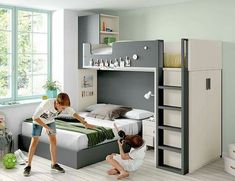 two children are playing in a bedroom with bunk beds and storage units on the wall