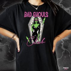 Arise from your spooky slumber and join our Bad Ghouls Club. Available in a variety of printed colours. (Check out our limited edition Lime Green t-shirt print limited to a 25 print run!) For sizing, please refer to the Unisex size guides pictured. UK - Size guide. XS - 3XL (100% organic cotton tee) USA - Size Guide. XS - 3XL (100% soft ringspun cotton tee) Edgy Halloween T-shirt With Screen Print, Halloween T-shirt With Screen Print For Alternative Fashion, Alternative Fashion Halloween T-shirt With Screen Print, Alternative Fashion Crew Neck T-shirt With Character Print, Character Print Crew Neck T-shirt For Alternative Fashion, Edgy Halloween T-shirt With Sublimation Print, Halloween Graphic Print T-shirt, Edgy T-shirt With Sublimation Print For Halloween, Pre-shrunk T-shirt For Halloween Alternative Fashion