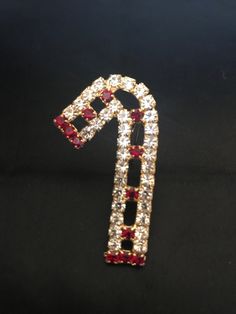 Estate Find ,Wonderful Prong Set Red And Clear Rhinestone Candy Cane Brooch Pin Is Set In Gold Plated Metal,High Quality Holiday Jewelry,In Excellent  To Mint Condition ,Large And Beauty Unsigned. Measure: 1 7/8" High x 3/8"Wide. If Yo Have Question Please Contact Me. Standard Shipping With Tracking. Thank For Looking. Holiday Jewelry Gift With Rhinestones, Christmas Festive Jewelry With Rhinestones, Holiday Rhinestone Jewelry For Gifts, Holiday Rhinestone Jewelry Gift, Holiday Gift Jewelry With Rhinestones, Rhinestone Jewelry Christmas Gift, Christmas Gift Jewelry With Rhinestones, Christmas Gift Rhinestone Jewelry, Red Rhinestone Brooch For Gift