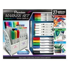 an assortment of markers and pens in a display box with the package on it's side