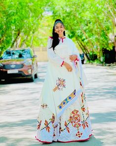 This Habesha Kemis is a true masterpiece of traditional Ethiopian fashion, with its exquisite Menen fabric and intricate Tilf design. The Menen fabric is renowned for its softness and durability, making this Kemis not only beautiful but also comfortable to wear. The Tilf design is intricate and delicate, with a pattern that is both modern and traditional, with clean lines and bold shapes that create a unique and eye-catching look. The Tilf design extends down the front of the Kemis, creating a v Ethiopian Fashion, Eritrean Dress, Habesha Dress, Habesha Kemis, Traditional Jewelry, A Pattern, Clean Lines, Formal Event, Custom Fit