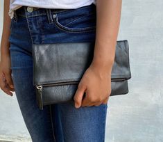 This clutch is a perfect day bag. Made for simplicity, this classic leather clutch brings timeless elegance to your style. Made of genuine leather, this clutch goes with all seasons and occasions.  SPECIFICATIONS ♥ Photo shown is size L ♥ Size     L (shown) : 33 x 18 cm / 12.9 x  7 inch (folded) & 33 x 30 cm / 12.9 x  11.8 inch (unfolded)     S : 26 x 16 cm / 10.2 x 6.9 inch (folded) & 26 x 26 cm / 10.2 x 10.2 inch (unfolded)  ♥ Material : genuine leather ♥ YKK zipper  ♥ Zippered inside pocket for phone.  ♥ Suede fabric lining  ♥ Color : Tan (Please note that color shade varies from one material and another and there is no exact same piece) BULK ORDER We accept bulk orders for our clutches. We give 15% off for a minimum of 10 items for the clutch. Please leave me a message if you want to o Everyday Leather Clutch With Fold Over Clasp, Versatile Clutch With Fold Over Clasp For Everyday Use, Versatile Leather Clutch With Fold Over Clasp, Versatile Envelope Clutch For Everyday, Everyday Rectangular Clutch With Fold Over Clasp, Versatile Everyday Envelope Clutch, Everyday Crossbody Clutch With Fold Over Clasp, Classic Everyday Clutch In Soft Leather, Classic Soft Leather Clutch For Everyday Use