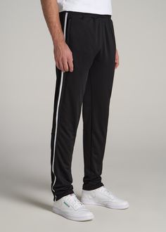 About Our Tall Men's Pants These men's tall athletic pants are a classic take on an athleisure essential. When it comes to athleisure, a good fit is key. You need something that's comfortable enough to relax in yet capable enough to work out in – but as a tall guy, it can be hard to find options that work for your height. You either have to compromise on a baggy fit or settle for lengths that are way too short. Not anymore. We know how hard it is to find quality styles when you're tall, which is Black Go-dry Full Length Bottoms, Sports Sweatpants With Elastic Side Panels And Tapered Leg, Black Sports Bottoms Long Pants, Black Sports Long Pants, Sports Joggers With Side Pockets, Sports Full-length Joggers With Side Pockets, Black Sportswear Pants For Sports, Tapered Leg Sweatpants With Elastic Side Panels, Full-length Sports Joggers With Side Pockets