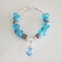 One Of A Kind Pretty Aqua & Silver Handmade Bracelet With A Crystal Oval Charm & Beads. Brand New, Never Worn. Please See All Photos, As They Are Part Of The Description. Handmade Blue Sterling Silver Charm Bracelet, Blue Sterling Silver Beaded Bracelets With Faceted Beads, Silver Crystal Bracelet With Large Beads For Jewelry Making, Blue Beaded Crystal Bracelet In Sterling Silver, Blue Beaded Sterling Silver Crystal Bracelet, Blue Nickel-free Charm Bracelet With Round Beads, Handmade Charm Bracelets, Snowflake Bracelet, Holiday Bracelets