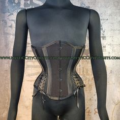 "design: MCC-58 ( design for inverted triangle body type)  BLACK COTTON/Mesh ORIGINAL design/photo: \"MystiC City Corsets\" - cotton twill/metallic PVC  - cotton lining steel boning  - 6 x 12mm wide \"white\" flat steel flexible bones  - 20 x 6mm wide spiral steel bones - steel busk (STIFF) - boned underbusk for extra stiff front support ( 1\" wide flat bone can be easy removed) - floating modesty panel: 5\" wide ( boned) - waist tape - high quality grommets - black lacing cord waist can stretch Black Fitted Steampunk Corset, Gothic Black Corset With Medium Bust Support, Black Stretch Overbust Corset Dress, Black Stretch Corset Dress Overbust, Black Underbust Corset Belt With Boning, Black Underbust Corset Belt With Corset Back, Underbust Mesh Corset With Boned Bodice, Black Stretch Corset Belt With Corset Back, Black Overbust Corset With Medium Bust Support