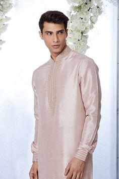 This rose gold silk kurta set features kiran dori embroidery on the collar, cuff and placket. It is paired with a jacquard trouser. Complimenting footwear is also available.From Seema Gujral's Tuscan Summer collection. DELIVERY TIMEPlease allow 8-12 weeks for your outfit to arrive.FABRIC DETAILSSilkProfessional cleaning only. Tuscan Summer, Dori Embroidery, Seema Gujral, Silk Kurta Set, Kurta Set For Men, Silk Kurta, Gold Silk, 12 Weeks, Kurta Set