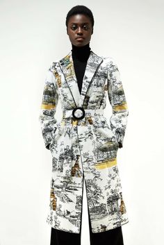 Impeccable crafted with elegance and modernity. This white printed mid-weight topcoat took its name from the gardens of Paris. The bold but romantic fabric is carefully cut to reflect the art of the print. The officer collar has front closure with two press fasteners while there is an additional belt for fastening at waist. Cut for a tailored fit, this style is designed with structure shoulders and an outline piping in a long line shape with deep side pockets. The interior is fully lined, expert Romantic Fabric, Top Coat, Concept Store, Men's Blazer, Piping, Casual Button Down Shirt, Greece, Men Casual, Blazer