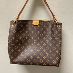 Louis Vuitton Monogram Graceful Pm Gently Used In Excellent Condition Exterior And Interior. The Luggage Tag Isn’t Included. Measurements: 12" L X 4.75" W X 10" H Classic Gold Monogram Canvas Shoulder Bag, Brown Signature Coated Canvas Shoulder Bag With Gold-tone Hardware, Gold Monogram Canvas Shoulder Bag For Daily Use, Gold Monogram Canvas Shoulder Bag With Dust Bag, Gold Monogram Canvas Shoulder Bag For Shopping, Everyday Luxury Signature Coated Canvas Shoulder Bag, Brown Leather Shoulder Bag With Monogram Print, Luxury Monogram Print Shoulder Bag For Daily Use, Everyday Monogram Canvas Shoulder Bag With Branded Hardware