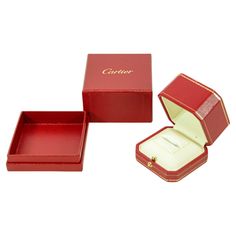 Cartier Red Leather Gilt Embossed Ring Presentation Storage Travel box. Cartier ring presentation box with outer box Cartier Paris red leather and gold travel ring jewelry storage box. White lining great to store your Cartier trinity ring. Made in France. Case is white suede lined. Gold tone hardware. Push lock closures. Dimensions: Cartier box : 3" W x 3 L x 2.25" H. Outer Box: 3.5" W x 3.5" L x 2.5 " H Cartier presentation box and storage box only. The ring is not part of the sale, for presentation only. Condition, the red leather is pilling on some corners, see pictures and video. About: Cartier is a renowned French luxury goods conglomerate founded in 1847 by Louis-François Cartier in Paris. Famous for its exquisite jewelry and timepieces, Cartier has become a symbol of elegance, sophi Cartier Rectangular Jewelry For Gift, Formal Rectangular Jewelry With Original Box, Luxury Red Jewelry For Proposal, Red Luxury Jewelry For Proposal, Luxury Rectangular Rings For Gift, Luxury Rectangular Rings As Gift, Luxury Rectangular Rings As A Gift, Cartier Packaging, Travel Ring