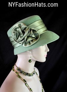 Dusty Lime Sage Green Winter Wool Designer Satin Rosette Bow Women's Fashion Hat. The Small Brim Tilts Downward On This Classic Styled Dress Hat. A Satin Band Encircles The Crown Of This Simple Yet Very Elegant Dress Hat.  This Stylish Wool Hat Can Also Be Work As A Casual Statement Piece. This Statement Hot Green Satin Hat Is Custom Made And Designed By NY Fashion Hats Couture Millinery Headwear Apparel. This Hat Is Suited For Weddings, Brides, Mother Of The Bride, Church, Temple, Sabbath, Form Hats Ny, Winter Wool Dress, Brides Mother, Hot Green, Women Hats Fashion, Bridal Hat, Bow Women, Dress Hat, Designer Hats