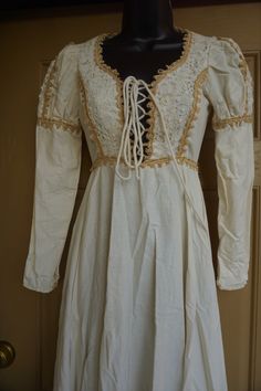 "Black label Gunne Sax prairie dress. Zips in the back and laces in the front of bust. Fits like modern XS -please see measurements. Condition is great with no flaws to note!! Measurements taken across front laid flat 16\" across front armpit to armpit 12\" across front of waist 58\" length" Bohemian Fitted Dress With Lace-up Back, Fitted Bohemian Dress With Lace-up Back, Bohemian Puff Sleeve Dress With Lace Trim, Fitted Bohemian Maxi Dress With Gathered Sleeves, Bohemian Fitted Maxi Dress With Gathered Sleeves, Bohemian Dresses With Lace Trim And Puff Sleeves, Vintage Prairie Dress With Gathered Sleeves, Fitted Peasant Dress With Square Neck, Fitted Square Neck Peasant Dress