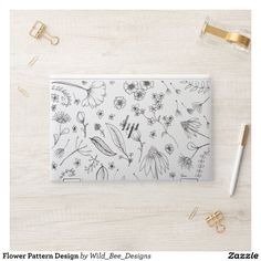 a flower pattern design by wild - bee designs on a white background with gold accents