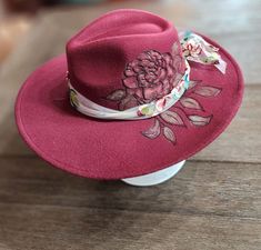 poly wide brim hat hand burned with flower pattern. Hand colored and hand made floral band. Adjustable and nice quality. beautiful wine color ... fun for any event, awesome Christmas gift! Burgundy Wide Brim Hat For Summer, Burgundy Summer Hat With Curved Brim, Summer Burgundy Hat With Curved Brim, Burgundy Curved Brim Summer Hat, Summer Burgundy Curved Brim Hat, Handmade Fitted Fedora For Country Events, Handmade Red Brimmed Fedora, Handmade Brimmed Fedora For Kentucky Derby, Western Fedora With Curved Brim As Gift