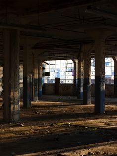 an empty building with lots of windows in it