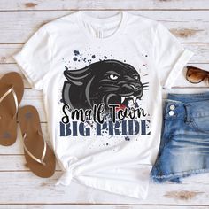 The Small Town Big Pride Panther shirt is perfect for the fall season. This shirt makes a great football mom gift! This soft school spirit tee is everything you've dreamed of and more. This trendy shirt is perfect for the season layered under your favorite cardigan! It feels soft and lightweight, with the right amount of stretch. It's comfortable and flattering for all.  Show off your personality with our fun and unique designs!   ** P R O D U C T   D E T A I L S **  - High Quality, Super Soft and Comfy Bella + Canvas T-Shirt  - 100 % Pre-Shrunk Cotton  (heather colors are polycotton blend)  - Direct to Garment print (no stencils or vinyl which means it will last a lot longer)   - Printed and Shipped in the USA  - Due to different monitor screens colors may vary ** S I Z I N G **  - Consul Panthers Football Shirt, School Spirt Ideas Shirts, Panther Football Shirts, Casual T-shirt For School Football Season, School Spirit Tops For Football Season, Casual School T-shirt For Football Season, Casual Tops For School Football Season, High School Spirit Shirts, Football Spirit Shirts