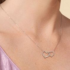 Two twisted hearts intertwined - together, forever. This heart pendant in white gold features a big and small heart cut-out linked together as a symbol of everlasting love. Diamonds adorn the pair of hearts. This necklace can represent the special bond between sisters, mother and child, or couples. Hearts Intertwined, Twisted Heart, Heart Cut Out, Floral Pendant, Everlasting Love, Together Forever, Fancy Color Diamonds, Big And Small, Small Heart