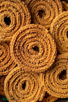 some very tasty looking food that looks like cinnamon rolls or crackers are stacked on top of each other