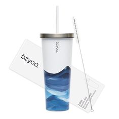 a white and blue cup with a straw in it next to a tag that says oxxo