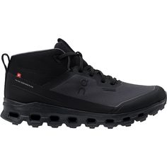 a pair of black hiking shoes on a white background