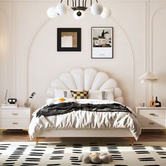 a white bedroom with black and white decor