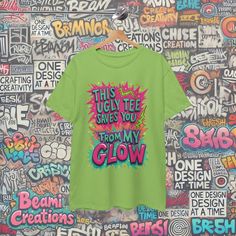 ✨ "This Ugly Tee Saves You from My Glow" - When you're just too fabulous for an ordinary shirt, this tee steps in! With chaotic, wild colors and a mismatched design, it lets the world know that your beauty doesn't need a stunning outfit - the shirt does all the "ugly" work for you! 💥 👕 Crafted from high-quality cotton, this unisex tee offers comfort and durability. The playful design, featuring bright, mismatched colors and a scribbled font, is purposefully "ugly" to let your beauty shine even Cheap Novelty Slogan T-shirt, Crazy Colour, Stunning Outfits, Statement Shirt, Funny Tees, Playful Design, One Design, Save Yourself, For Friends