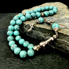 "This handmade gemstone tasbeeh; It is also known by different names such as misbaha, prayer beads, rosary, chapelet, dhikr beads, misbah, sibha, stress beads. This islamic tasbih is a great muslim gift idea. All beads are turquoise gemstone. The known proferties of natural turquoise stone are: -It keeps bones healty -It is beneficial for migraine and reduces cough -It regulates blood circulation and blood pressure. Tassel material is stainless metal. PRODUCT DETAILS Weight: 55gr Grain Shape: Ro Spiritual Turquoise Beaded Bracelets With Polished Beads, Hand-strung Round Beads Rosary As A Gift, Hand-strung Rosary As A Gift, Hand-strung Rosary With Round Beads As Gift, Turquoise Gemstone Beads For Gift, Round Beads Rosary With Natural Stones For Gift, Gift Rosary With Round Natural Stones, Adjustable Bohemian Rosary With Gemstone Beads, Bohemian Round Beads For Jewelry Making