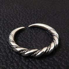 Replica of an archeological artifact from Gotland, Sweden. Made of sterling (925) silver. The original artifact is dated 9th-11th century A.D. The ring is 3.5mm (0.14 inch) thick. It can be adjusted between sizes 7 and 11 US scale (15 and 25 european scale). Medieval Hand Forged Sterling Silver Jewelry, Viking Style Sterling Silver Ring, Medieval Sterling Silver Jewelry In Antique Silver, Hand Forged Silver Viking Jewelry, Medieval Sterling Silver Nickel-free Jewelry, Medieval Sterling Silver Engraved Rings, Medieval Engraved Sterling Silver Rings, Hand Forged Silver Medieval Jewelry, Silver Byzantine Rings Hallmarked