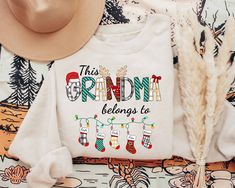 Grandma Christmas Sweatshirt, This Grandma Belongs To Shirt, Grandma Claus Shirt, Custom Grandma Shirt With Grandkids Name, Personalized Christmas Gifts For Grandma  ♥ All items are made to order. ♥ Production & shipping time:  - Production time is 3 - 5 business days from order date - Shipping time:  + Standard shipping: 5 - 7 business days + Express shipping: 3 - 5 business days ♥ Shirt Sizing: Unisex fit and run true to size. If you are unsure on sizing, please use our sizing chart in the pro Veterinary Technician Gifts, Vet Tech Shirt, Christmas Gifts For Aunts, Book Christmas Tree, Grandmas Christmas, Christmas Gifts For Grandma, Christmas Party Shirts, Gifts For Aunt, Gifts For Veterinarians