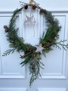 a christmas wreath hanging on the front door