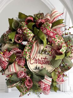 a christmas wreath hanging on the front door