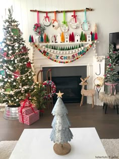 a decorated christmas tree in front of a fireplace