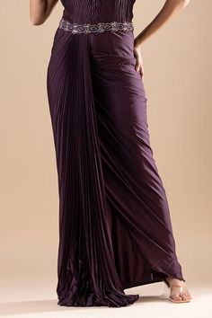 Wine pleated armani satin draped saree gown with crystals, cutdana, Swarovski, and sequins hand embroidery. Comes with a detachable palla. - Aza Fashions Pre-draped Cocktail Evening Dress With Folds, Pre-draped Silk Evening Dress With Folds, Draped Pleated Evening Dress, Pleated Draped Evening Dress, Pleated Back Draped Evening Dress For Party, Draped Gala Dress With Folds, Pre-draped Gala Evening Dress With Folds, Evening Gown With Pleated Pre-draped Style, Pre-draped Evening Dress With Pleated Back For Cocktail