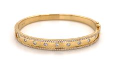 This best-selling style boasts a polished gold finished inlaid with 115 sparkling round-cut diamonds. Two rows of glittering diamonds line this bangle - a great piece to wear alone or as the anchor of a stack. An instant classic that will become your signature. Metal: 18K Yellow Gold Diamond Weight: 1.10ct t.w.Diamond Shape: 115 Round Brilliant cutsSetting: Burnish / InlayBangle Width: 46 x 58mm L: 7mm Estimated production time is 4 - 5 weeks. The Anchor, Diamond Glitter, Diamond Shape, Round Cut Diamond, Round Brilliant, Bangle Bracelet, Gold Finish, Round Cut, Gold Diamond