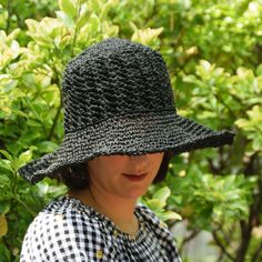 * Adult One size; Fits head circumference 22"/ 54 cm and up (contact us for custom colors/sizes). D E S C R I P T I O N *Get stylish with the most comfortable, durable summer hat you will ever own. Hand crocheted with a sustainable cotton and raffia blend this lightweight sun hat features an adjustable wire brim to fit any style and a detachable cotton sunflower pin to showcase your earth friendly vibe!  *  The optional, high quality satin lining adds protection for all hair types and the crown Handmade Adjustable Sun Hat For Garden Party, Adjustable Black Crochet Hat For Beach, Adjustable Black Crochet Hat For The Beach, Black Summer Crochet Hat For Beach, Black Summer Hat, One Size, Black Crochet Hat For Beach In Summer, Handmade Black Crochet Hat For Beach, Black Crochet Hat For Summer Beach, Black Crochet Hat With Curved Brim