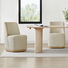 two chairs and a table in front of a window