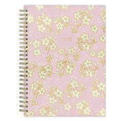 a pink notebook with gold foil flowers on it