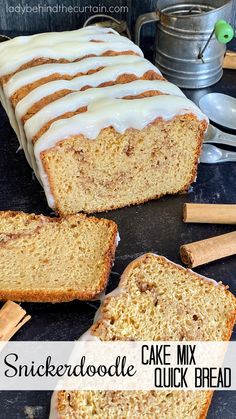 sliced cake mix quick bread with icing and cinnamon sticks on the side for serving