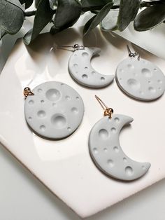 Detailed moon earrings. Each pair comes with one full moon and one crescent moon. Lightweight earrings, you'll forget you even have them on! White Handmade Moon-shaped Earrings, White Celestial Earrings With Moon Charm, Moon-shaped White Earrings For Gift, White Moon-shaped Earrings As Gift, White Moon-shaped Earrings For Pierced Ears, White Round Moon Phase Earrings, White Moon-shaped Earrings For Gifts, White Crescent Earrings As Gift, White Crescent Earrings For Gift