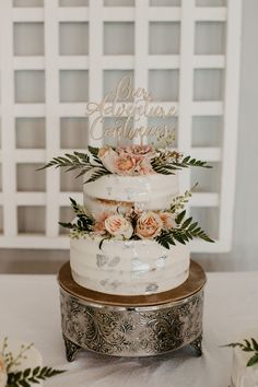 a wedding cake sitting on top of a table