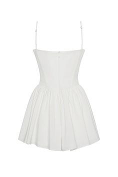 Discover the epitome of femininity in our Bellini Bustier Mini Dress. This classic, white mini dress is complimented with wire bustier cups, side pockets and cinching waistline which effortless skims down the body to a flared skirt hemline. The mini length makes it a fun and flirty dress perfect for any summer occasion! Perfer midi length? Try our "Ballerina Dress" - same style, just in midi length. Bustier Mini Dress, Ballerina Dress, Trendy Dress, Flirty Dresses, Bustier Dress, Bellini, Flared Skirt, Corset Dress, Trendy Dresses