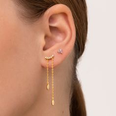 Amazing gold earrings with zircons and two long golden chain. It is an elegant jewel that will give to your look a sophisticate touch. It is perfect to combine with other earrings or wear it alone for a minimalist look. Made of sterling silver 925 and plated with 18kt gold. Details: * Crafted in Gold plated .925 sterling silver * Also available in 925 sterling silver * SOLD INDIVIDUALLY OR BY PAIRS All jewelry comes in beautiful packaging, gift ready. Made with love Feel free to contact me with Gold Dainty Cubic Zirconia Ear Climbers, Dainty Cubic Zirconia Earrings With Adjustable Chain, Dainty Gold Cubic Zirconia Ear Climbers, Dainty Earrings With Delicate Chain For Party, Dainty Delicate Chain Earrings For Party, Elegant Ear Climbers With Adjustable Chain For Gift, Gold Plated Delicate Chain Earrings For Party, Elegant Gold Ear Climbers With Adjustable Chain, Party Earrings With Delicate Gold-plated Chain