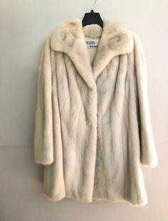 "The Evans Collection at Jordan Marsh Cream Fur Mink Stroller Coat Beautiful mink Cream lining Small stain inside lining, see photo Side pockets Measurements: Length: 34.5\" Sleeve length: 23\" Armpit to bottom hem: 20\" Across chest (armpit to armpit): 21\" Back collar height: 3\" Back across shoulder: 17.5\" Back armpit to armpit: 20.5\" Good condition 3 hook closures Label reads: \"The Evans Collection At Jordan Marsh\"" Cream Fur Coat, White Mink Coat, Vintage Cream Fur Coat For Winter, Beige Fur Coat, Vintage Long Beige Fur Coat, Luxury Vintage Beige Fur Coat, Glass Portrait, Vintage Long Sleeve Mink Outerwear, White Fur Coat