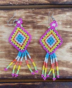 Handmade Beaded Kite Earrings These beautiful handmade earrings are made by indigenous artisans from Chiapas, Mexico. It can take up to an hour to finish every pair! These beaded earrings are unique and lightweight, and are perfect for any occasion. They also make great gifts! * Lightweight, chic, unique and original multi-colored stud earrings. * If you would like some more pictures of these lovely earrings don't hesitate to message me. Multicolor Fair Trade Beaded Earrings, Artisan Beaded Earrings With Dangling Beads For Festival, Artisan Beaded Earrings With Round Beads For Festivals, Artisan Beaded Earrings, Southwestern Style Earrings With Round Beads For Festivals, Southwestern Style Earrings With Colorful Beads, Southwestern Style Round Bead Earrings For Festivals, Traditional Round Bead Earrings For Festivals, Traditional Round Beaded Earrings For Festival