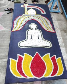 a large blue mat with yellow and red designs on it