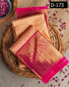 three pieces of pink and gold banaram saree on top of a wicker basket