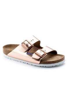 An icon of timeless design and legendary comfort, the Birkenstock® Arizona sandal has been defining style since 1973. A metallic finish transforms the classic look into your favorite be-seen pair, outfitted with tonal buckles to elevate the look. With an original contoured footbed for support, it'll feel uniquely yours wherever you take it. Classic Gold Sandals With Cushioned Footbed, Casual Gold Slides With Buckle Closure, Classic Gold Sandals With Leather Footbed, Classic Gold Sandals With Buckle Closure, Gold Slides With Textured Footbed, Birkenstock Sandals Arizona, Two Strap Sandals, Birkenstock Arizona, Sandals For Sale