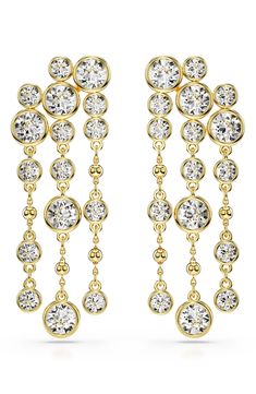 A sparkling cascade of bezel-set crystals shimmers in the light on these vintage-inspired chandelier earrings plated in polished goldtone. 2 1/8" drop; 3/4" width Post back Goldtone plate/crystal Imported Gold Crystal Chandelier Earrings For Formal Occasions, Gold Chandelier Earrings With Sparkling Stones For Formal Events, Gold Chandelier Earrings With Sparkling Stones For Formal Occasions, Gold Glamorous Chandelier Earrings For Formal Occasions, Formal Gold Crystal Chandelier Earrings, Glamorous Gold Chandelier Earrings For Formal Events, Gold Sparkling Chandelier Earrings For Formal Occasions, Gold Crystal Chandelier Earrings For Anniversary, Gold Chandelier Earrings With Sparkling Stones For Anniversary